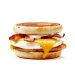 breakfast sandwich with egg, cheese, and bacon on an english muffin