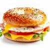 breakfast bagel sandwich with ham, egg, and cheese, white background. ai